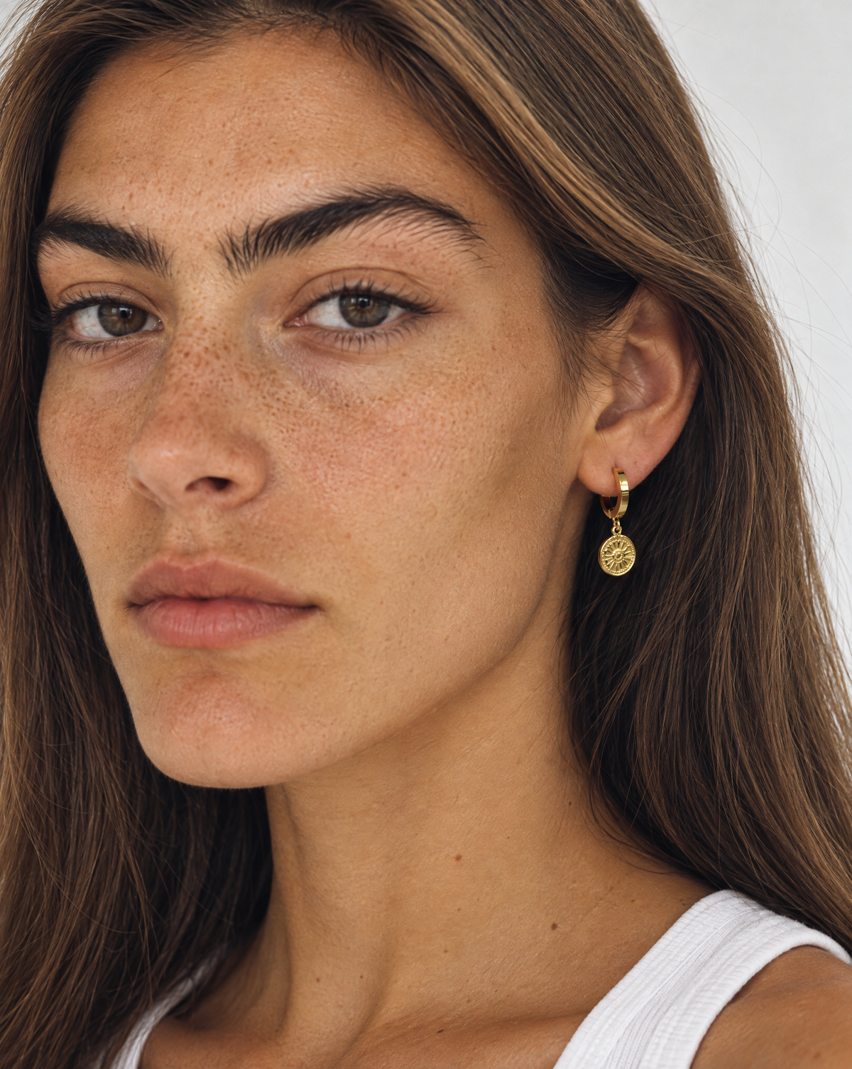 Flower Drop Hoops worn by a model